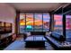 Comfortable living room features a gorgeous skyline view through expansive floor-to-ceiling windows at 360 E Desert Inn Rd # 1803, Las Vegas, NV 89109