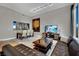Spacious living area featuring a dining table, a comfortable sofa, and an entertainment center, perfect for relaxation at 360 E Desert Inn Rd # 1803, Las Vegas, NV 89109