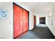 Modern building lobby with red entry doors, patterned flooring, and contemporary lighting at 360 E Desert Inn Rd # 1803, Las Vegas, NV 89109