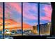 Captivating sunset view of the Las Vegas skyline through a large window at 360 E Desert Inn Rd # 1803, Las Vegas, NV 89109