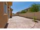 Stamped concrete patio with desert landscaping provides a welcoming space for outdoor enjoyment at 3615 Dutchmans Vine Ct, North Las Vegas, NV 89081