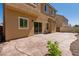Stamped concrete patio and desert landscaping combine for a serene and low-maintenance backyard at 3615 Dutchmans Vine Ct, North Las Vegas, NV 89081