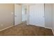 Bedroom featuring plush carpeting, neutral walls, a closet and open doors leading to the upper hallway at 3615 Dutchmans Vine Ct, North Las Vegas, NV 89081