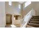 Spacious entryway with staircase, high ceilings, and views into adjacent rooms at 3615 Dutchmans Vine Ct, North Las Vegas, NV 89081