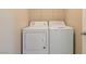 A well-maintained laundry room features a white washing machine and dryer at 3615 Dutchmans Vine Ct, North Las Vegas, NV 89081