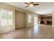 Open-concept living space featuring tile flooring, natural light, and access to the kitchen at 3615 Dutchmans Vine Ct, North Las Vegas, NV 89081
