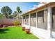 Backyard with green lawn, covered patio, and privacy wall at 3954 Crystal Trip Ct, Las Vegas, NV 89129