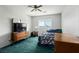 Bedroom with a TV, dresser, bedside lamp, and comfortable bed with patterned comforter at 3954 Crystal Trip Ct, Las Vegas, NV 89129