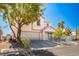 Attractive two-story home with a two-car garage, tidy landscaping, and a secure white metal fence at 3954 Crystal Trip Ct, Las Vegas, NV 89129