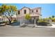 Inviting two-story home with neutral stucco, tile roof, well-kept front yard, and decorative white metal fence at 3954 Crystal Trip Ct, Las Vegas, NV 89129