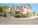 Charming corner lot home featuring a white fence, neat landscaping, and a welcoming facade at 3954 Crystal Trip Ct, Las Vegas, NV 89129