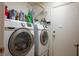 Well-equipped laundry room with Samsung washer and dryer and storage for detergent at 3954 Crystal Trip Ct, Las Vegas, NV 89129