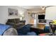 Inviting living space with tile floors, comfy sofas, and a staircase to the upper level at 3954 Crystal Trip Ct, Las Vegas, NV 89129