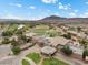 Gorgeous aerial view of the Stallion Mountain Golf Club clubhouse and community golf course with water features at 4062 Vulcan St, Las Vegas, NV 89122