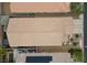 Aerial view showcasing the home's tile roof, patio, and landscaping within a well-maintained community at 4062 Vulcan St, Las Vegas, NV 89122