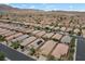 Residential community featuring uniform single-Gathering homes, streets, and desert landscaping at 4062 Vulcan St, Las Vegas, NV 89122