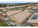 Aerial view of a backyard with patio seating, lush turf, and a covered gazebo at 4062 Vulcan St, Las Vegas, NV 89122