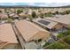 Aerial view of a backyard with patio, turf, and desert landscaping in a planned community at 4062 Vulcan St, Las Vegas, NV 89122