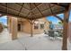 Outdoor living with covered patio, spa, and dining set, creating a relaxing entertainment space at 4062 Vulcan St, Las Vegas, NV 89122