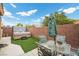 A backyard oasis featuring a spa, patio, and outdoor dining furniture for relaxation and entertainment at 4062 Vulcan St, Las Vegas, NV 89122