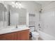 Bathroom including a single vanity, shower-tub combo, and built-in storage at 4062 Vulcan St, Las Vegas, NV 89122