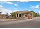 Community security gatehouse featuring stone accents, a tile roof, and security check-in at 4062 Vulcan St, Las Vegas, NV 89122