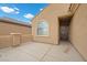 Home exterior featuring a private front patio with stucco walls and decorative iron door at 4062 Vulcan St, Las Vegas, NV 89122
