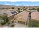 Single-Gathering home featuring a two-car garage, desert landscaping, and tile roofing at 4062 Vulcan St, Las Vegas, NV 89122