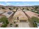 Inviting single-story house with a two-car garage, desert landscaping, and a cozy front porch at 4062 Vulcan St, Las Vegas, NV 89122