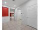 Bright hallway featuring tile flooring, recessed lighting, and access to various rooms in the house at 4062 Vulcan St, Las Vegas, NV 89122