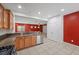 Open kitchen with stainless steel appliances and a view into the brightly colored living area at 4062 Vulcan St, Las Vegas, NV 89122