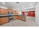 Spacious kitchen with stainless steel appliances, wood cabinets and plenty of counter space at 4062 Vulcan St, Las Vegas, NV 89122