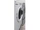 Close up of the modern, stacked washer and dryer in the laundry room at 4062 Vulcan St, Las Vegas, NV 89122
