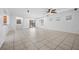 Spacious living room featuring tile flooring, neutral paint, and ample natural light at 4062 Vulcan St, Las Vegas, NV 89122