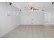 Bright living room features tile flooring, multiple windows, and recessed lighting at 4062 Vulcan St, Las Vegas, NV 89122