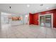 Open-concept living area with a view of the kitchen and backyard at 4062 Vulcan St, Las Vegas, NV 89122