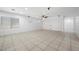 Spacious living room features tile flooring, a ceiling fan, and recessed lighting at 4062 Vulcan St, Las Vegas, NV 89122