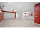Spacious living room with tile flooring and modern lighting fixtures at 4062 Vulcan St, Las Vegas, NV 89122
