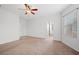Bright main bedroom with carpet, ceiling fan and ensuite bath at 4062 Vulcan St, Las Vegas, NV 89122