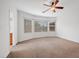 The main bedroom has carpet flooring, a ceiling fan and lots of natural light at 4062 Vulcan St, Las Vegas, NV 89122