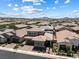 Aerial view featuring an array of homes, mountain views, and beautiful landscaping at 417 Honeybrush Ave, Henderson, NV 89011