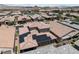 An aerial shot highlights a lovely home with solar panels in a thriving community at 417 Honeybrush Ave, Henderson, NV 89011