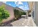Backyard featuring a hot tub, lattice fence, and rock landscaping at 417 Honeybrush Ave, Henderson, NV 89011