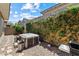 Backyard featuring a hot tub, lattice fence, and rock landscaping at 417 Honeybrush Ave, Henderson, NV 89011