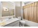 Bathroom featuring a vanity, toilet, and a shower with a curtain at 417 Honeybrush Ave, Henderson, NV 89011