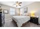 Comfortable bedroom features neutral walls, carpet, and a ceiling fan at 417 Honeybrush Ave, Henderson, NV 89011