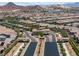 A picturesque community entrance with well-maintained landscaping and stylish architecture at 417 Honeybrush Ave, Henderson, NV 89011
