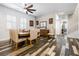 Dining area featuring a rustic wooden table, upholstered chairs, and wood-look floors at 417 Honeybrush Ave, Henderson, NV 89011