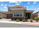 Charming two-story home featuring low-maintenance landscaping and a welcoming front entrance at 417 Honeybrush Ave, Henderson, NV 89011