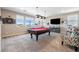 Upstairs entertainment space with pool table offers a relaxed and inviting atmosphere for leisure and recreation at 417 Honeybrush Ave, Henderson, NV 89011